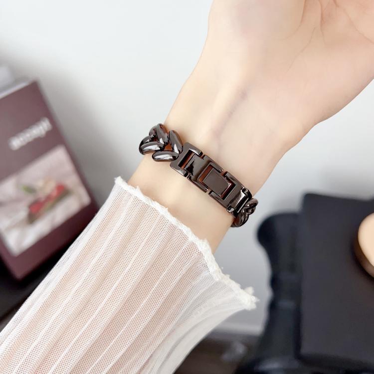 xDfind black metal watch band with V-shaped links worn on the wrist