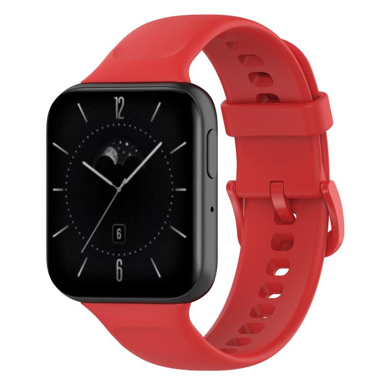 Red silicone watch band fitted to a rectangular smartwatch, with adjustable buckle and holes