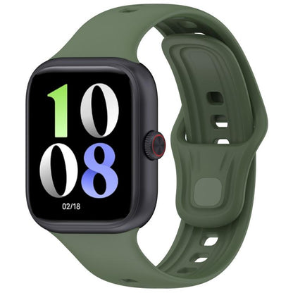 Dark green silicone watch band fitted to a black smartwatch, with adjustable holes and pin closure.