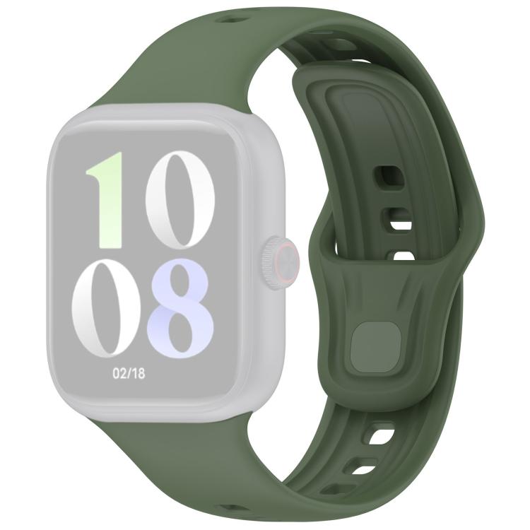 Dark green silicone watch band fitted to a pale smartwatch, with adjustable holes and pin closure.