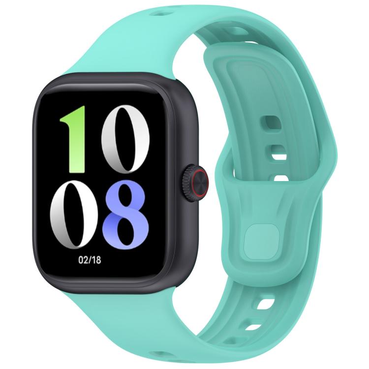 Mint green silicone watch band fitted to a black smartwatch, with adjustable holes and pin closure.