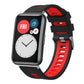 Black and red silicone watch band with silver buckle, shown on a smartwatch