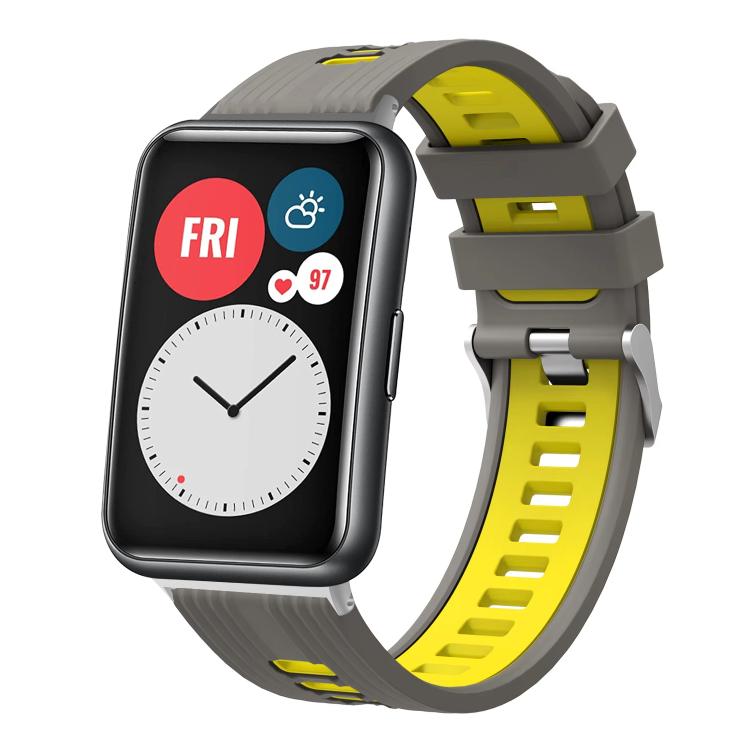 Gray and yellow silicone watch band with silver buckle on a smartwatch