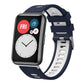 Navy and white silicone watch band with silver buckle on a smartwatch