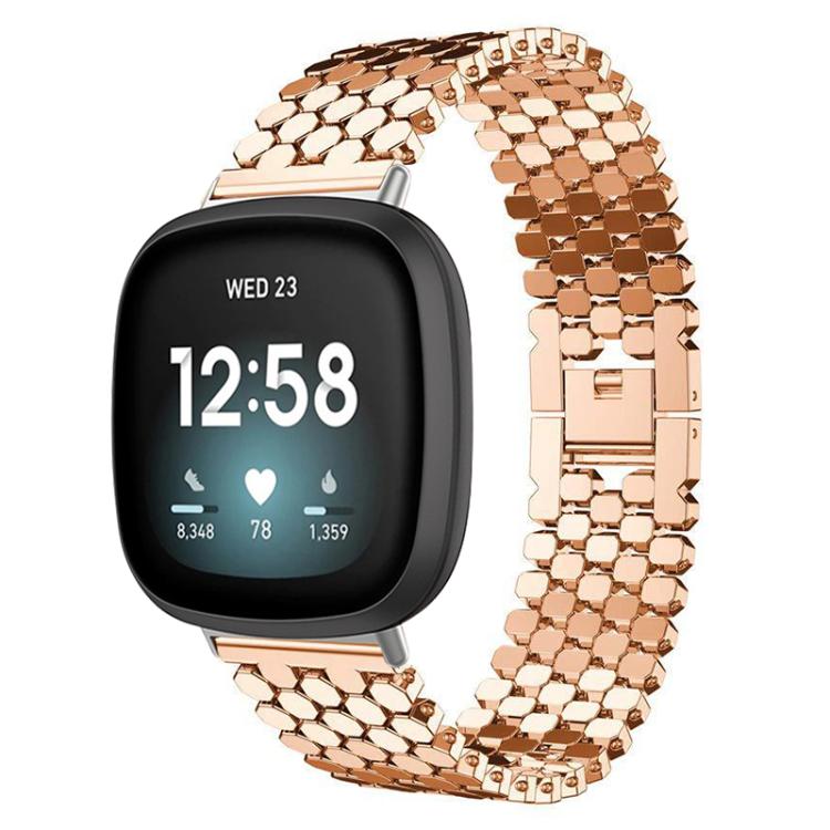 Rose gold metal fish-scale watch band fitted to a black smartwatch.