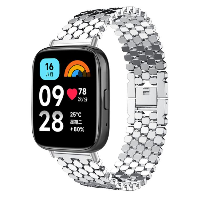 Silver fish-scale metal watch band shown on a rectangular smartwatch