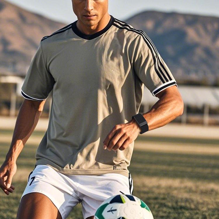 Black nylon watch band worn on the wrist during sports.