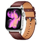 Wine red and tan vegan leather watch band with stitched edges and silver buckle