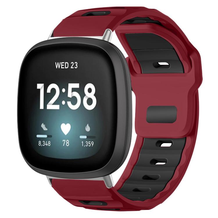 Wine red and black two-tone silicone watch band on a smartwatch