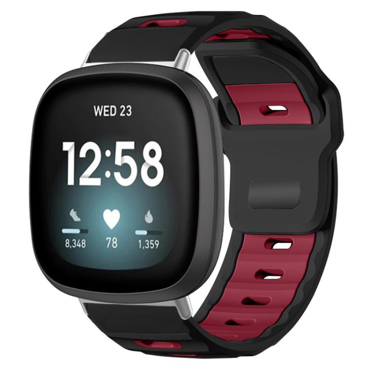 Fitbit watch with a black and wine red dual-color silicone band
