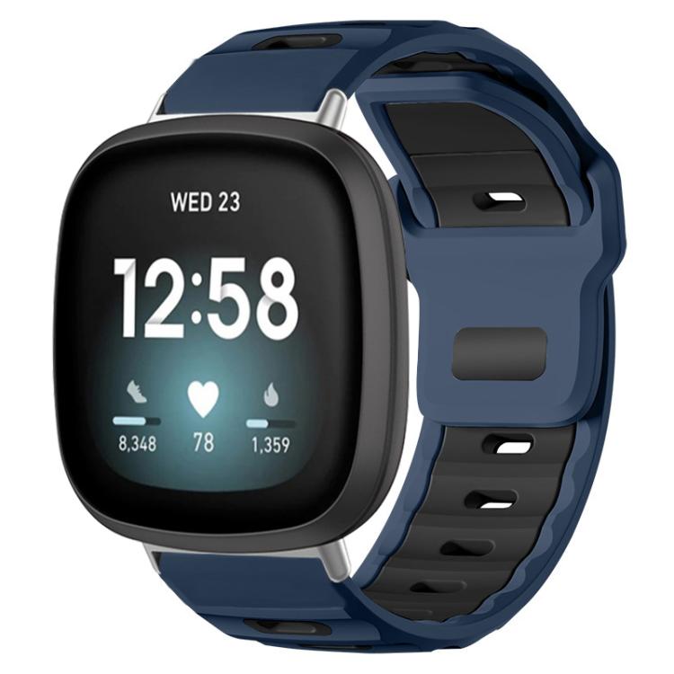 Fitbit silicone watch band in navy and black, shown fitted to a smartwatch