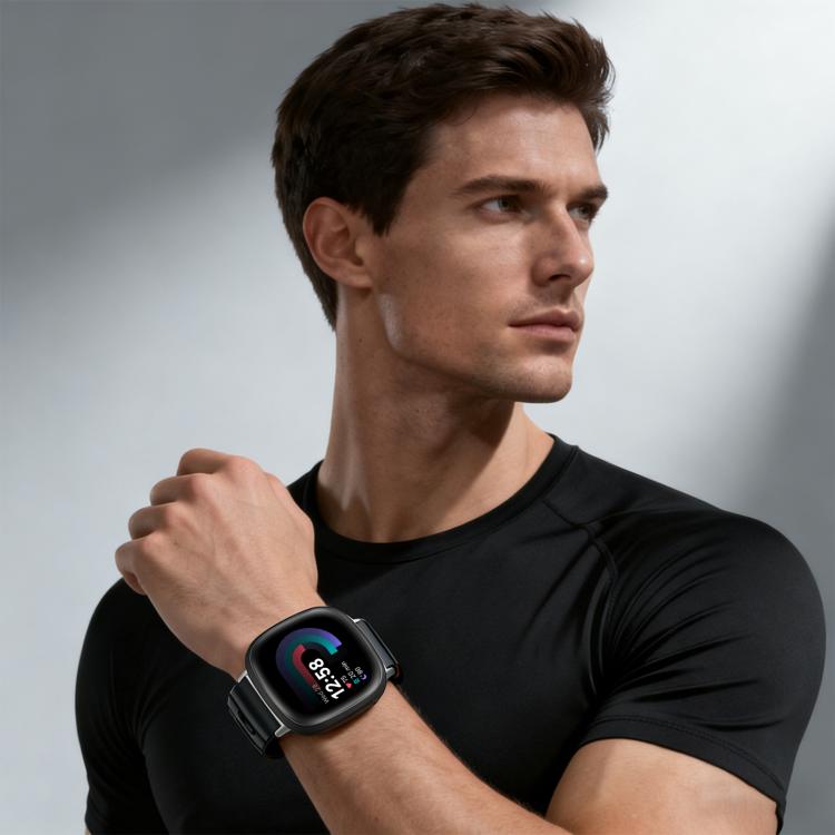 Fitbit smartwatch with a dark silicone band worn on a wrist