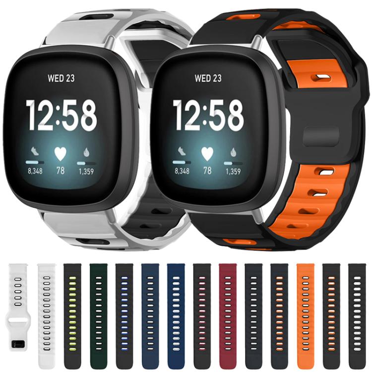Fitbit silicone watch bands, including white and black with orange, shown on watches