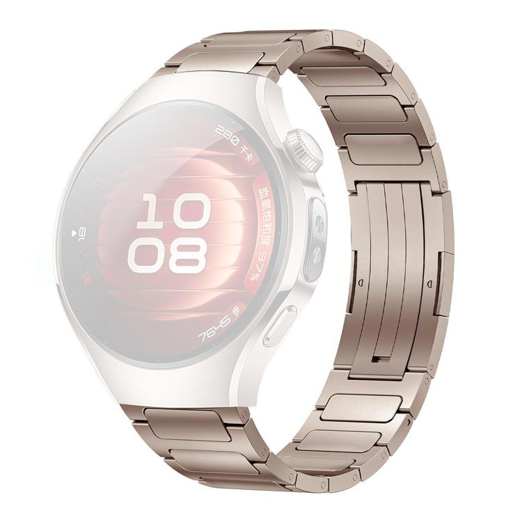 Gold titanium alloy watch band with linked design and fold-over clasp.