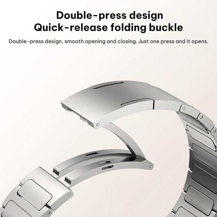 Silver fold-over watch band clasp shown open, with double-press quick-release mechanism.