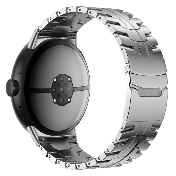 Silver titanium alloy watch band with segmented links and a safety buckle, shown on a watch