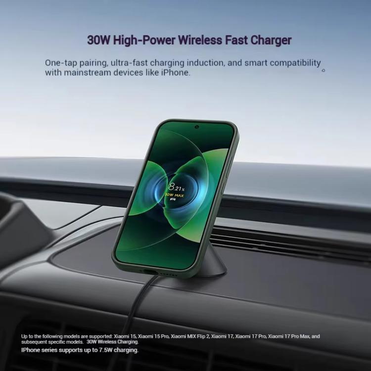 Magnetic wireless car charger holding a phone on the dashboard
