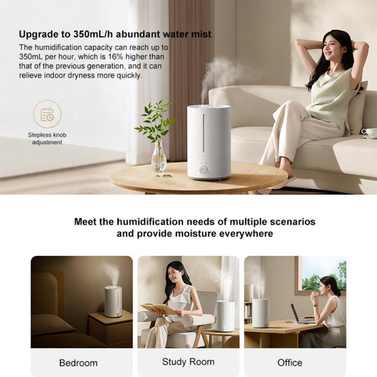 White humidifier on a table with top reservoir opening and front dial control