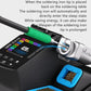 Soldering station tip inserting into holder on blue stand, showing control panel