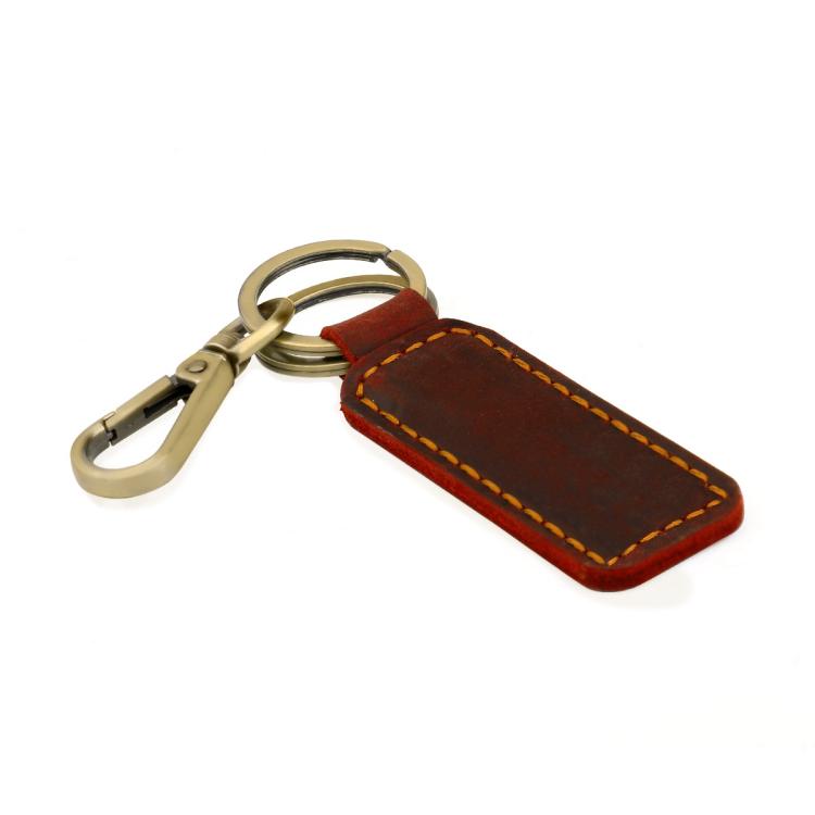 Burgundy leather car key chain with orange contrast stitching and brass metal clasp
