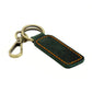 Dark green leather car key chain with orange contrast stitching and brass metal clasp