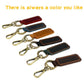 Assorted genuine leather car key chains with metal rings and clips, stitched leather pouches