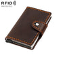 Dark brown leather card holder with snap strap and orange-stitched borders, slim design