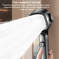 Close-up shower head spraying water with stop button on the handle