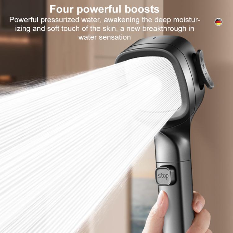 Close-up shower head spraying water with stop button on the handle