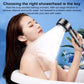 Handheld shower head spraying water over a person for full-body coverage