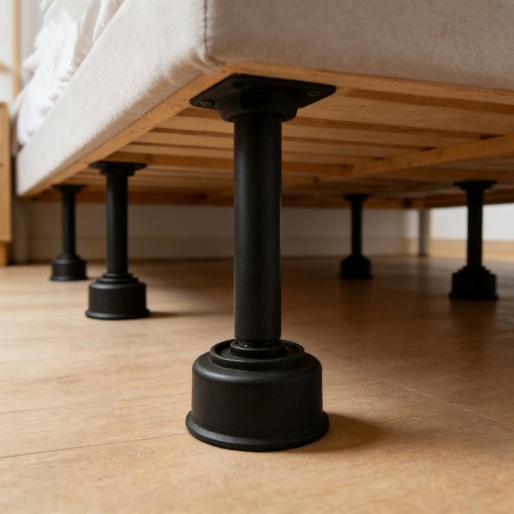 Black plastic furniture support leg with wide round base foot and central hole