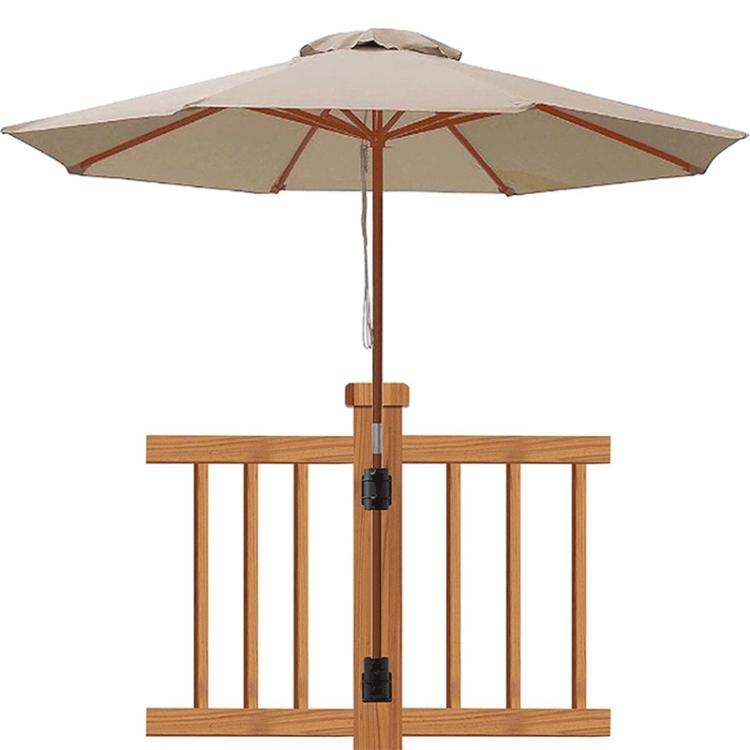 Umbrella holder mounting base centered on wooden deck railing with black clamps