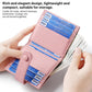 Light pink leather multi-card holder with snap buckle and card slots, held in hand