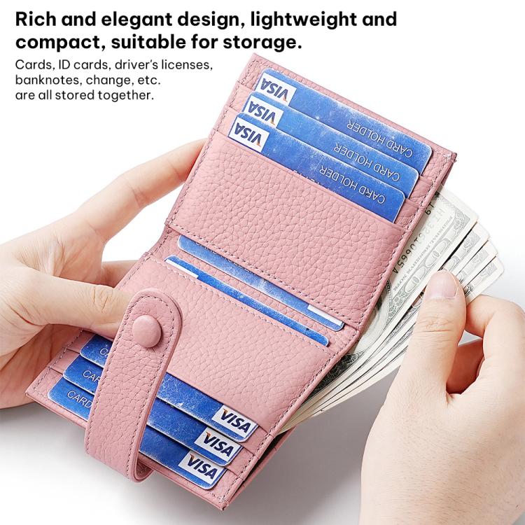 Light pink leather multi-card holder with snap buckle and card slots, held in hand