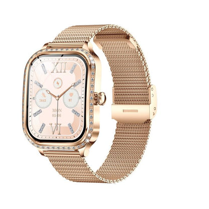 Gold-tone smartwatch with a crystal-accented case, pale dial, and woven metal mesh band