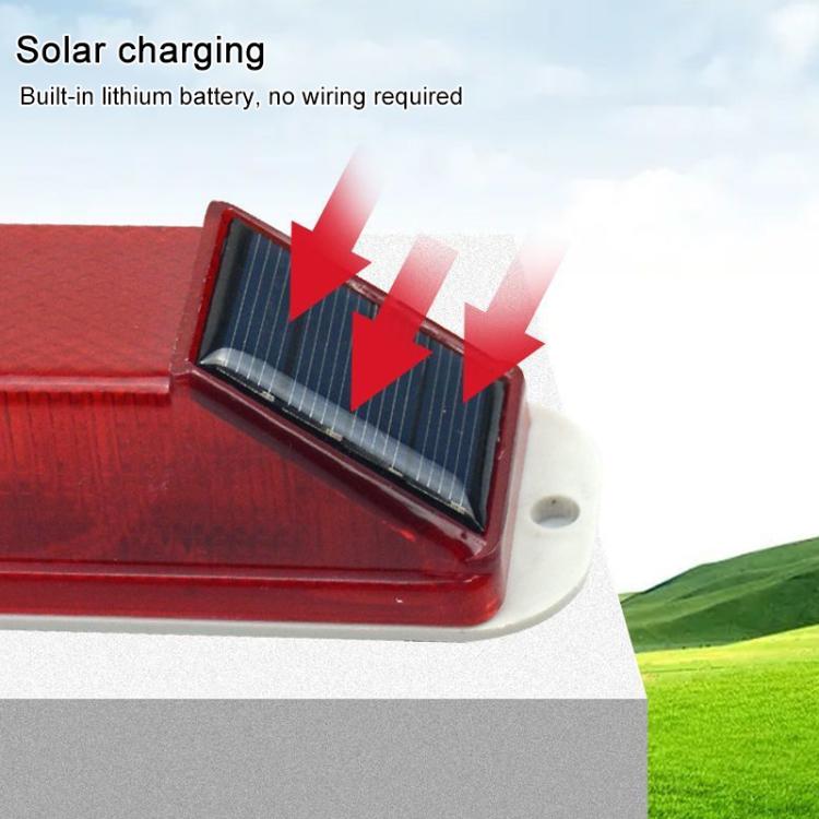 Solar LED warning light close-up of solar panel and red flashing lens