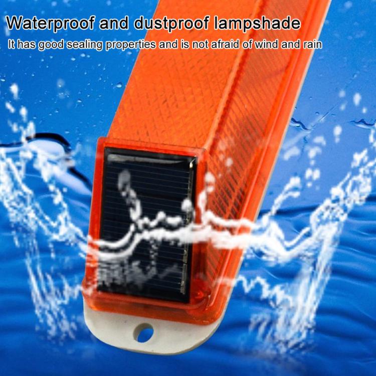 Solar-powered LED flashing warning light with solar panel, orange housing