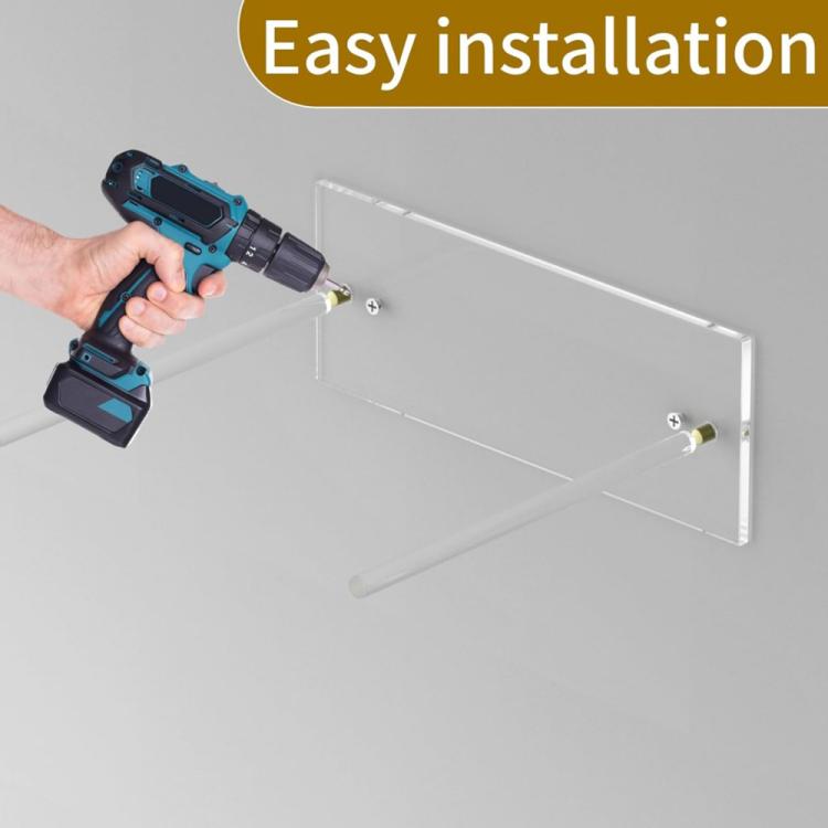 Wall-mounted clear acrylic hat rack with screws installed on a wall
