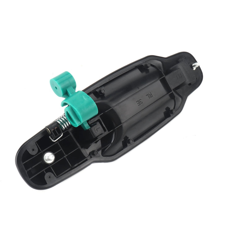 Left rear outside door handle underside, black housing with green mounting clips