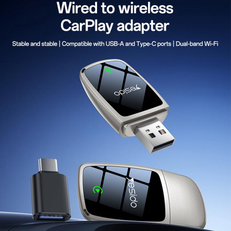 Wireless CarPlay adapter in silver with dual USB ports and black status screen