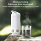 White wireless portable coffee maker steaming above a clear drinking cup