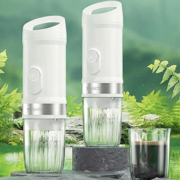 Two white portable coffee makers with blue buttons and clear cups