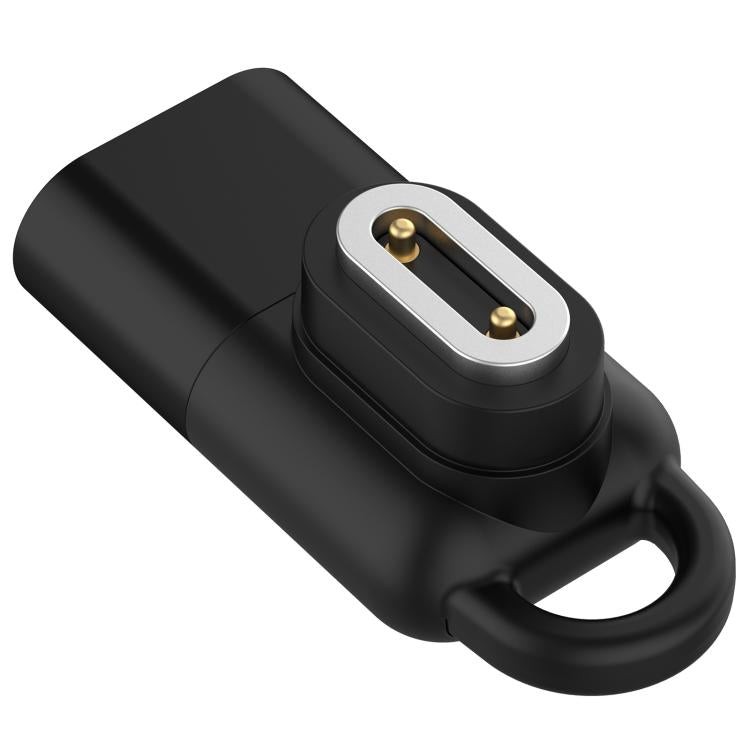 Black watch charging adapter with a silver-edged contact plate and carrying loop