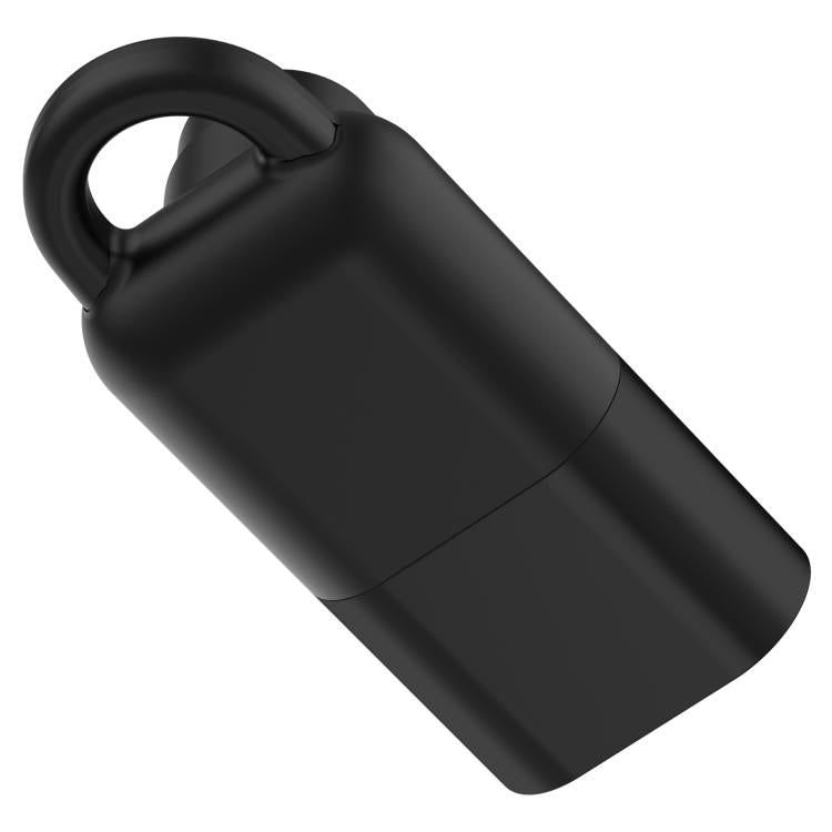 Back of a black watch charging adapter with a rounded carrying loop