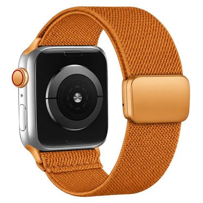 Orange nylon twill watch band with magnetic buckle shown on a smartwatch