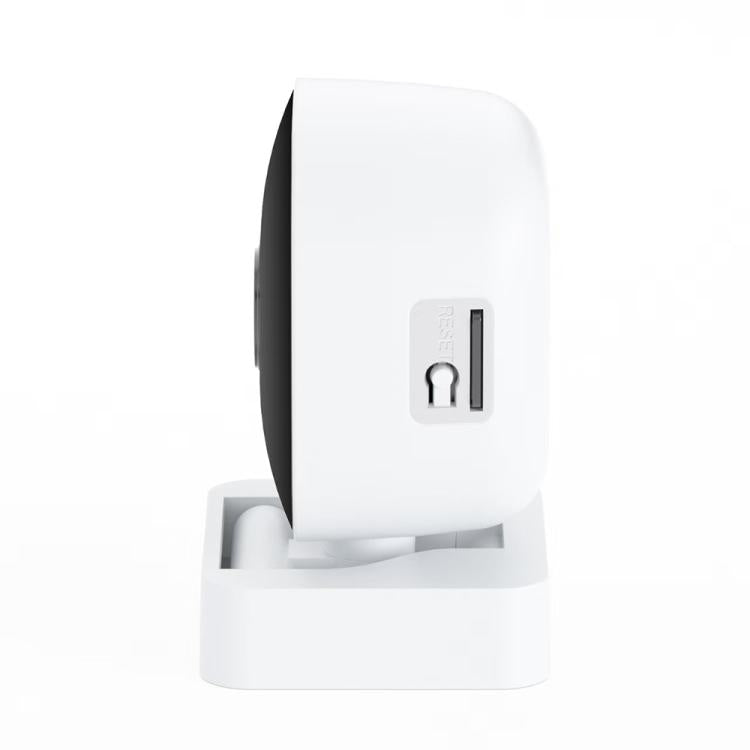 White security camera on a base with side panel and lens facing left