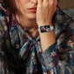 Gray braided nylon watch band with black accents, shown on a smartwatch worn on the wrist