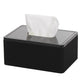 Black sound privacy device with white tissue emerging from top opening