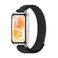 Black woven nylon watch band fitted to a silver smartwatch with a light display frame.