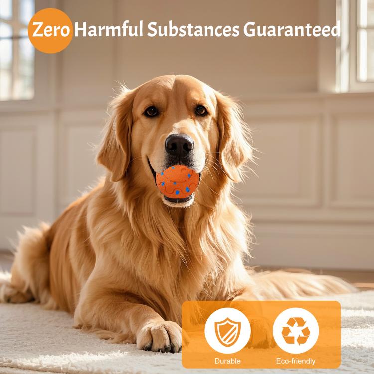Orange dog toy ball with blue design, held by a golden retriever